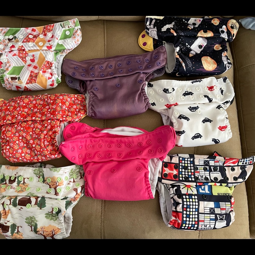 Lot of 8 Bum Genius cloth diapers.